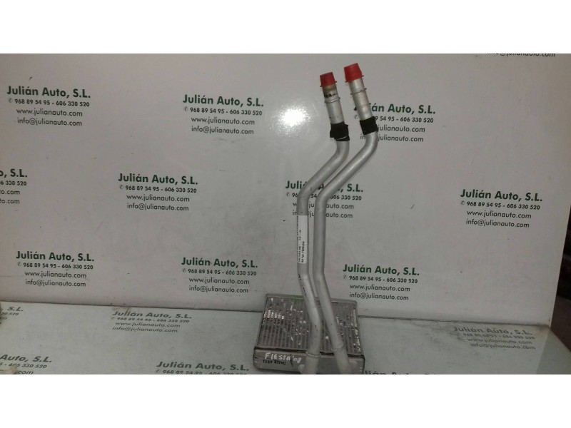 Recambio de radiador calefaccion / aire acondicionado para ford fiesta (cbk) ambiente referencia OEM IAM T2098J24C  