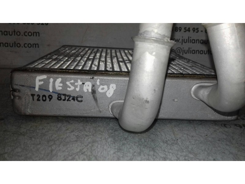 Recambio de radiador calefaccion / aire acondicionado para ford fiesta (cbk) ambiente referencia OEM IAM T2098J24C  