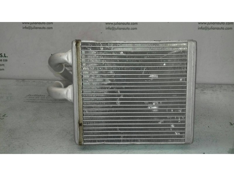 Recambio de radiador calefaccion / aire acondicionado para ford fiesta (cbk) ambiente referencia OEM IAM T2098J24C  
